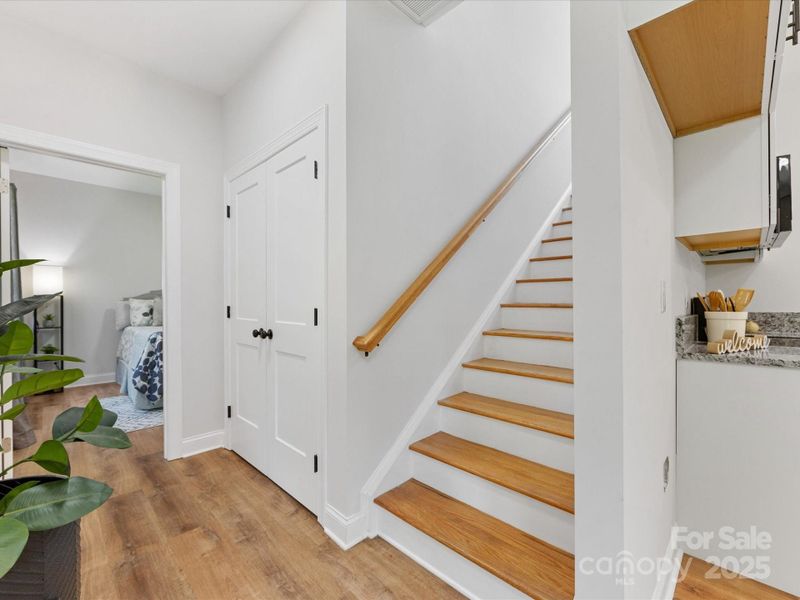 Wood stairs lead to spacious guest bedrooms. Wood stairs lead to spacious guest bedrooms.