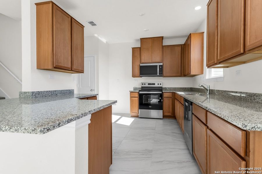 Furnished interior view inside a new home in Spanish Trails, San Antonio (Image 4).