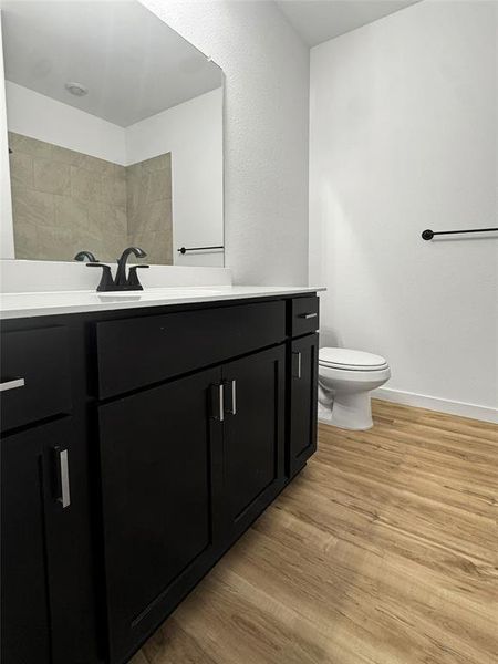 Bathroom with vanity and light wood-type flooring Bathroom with vanity and light wood-type flooring