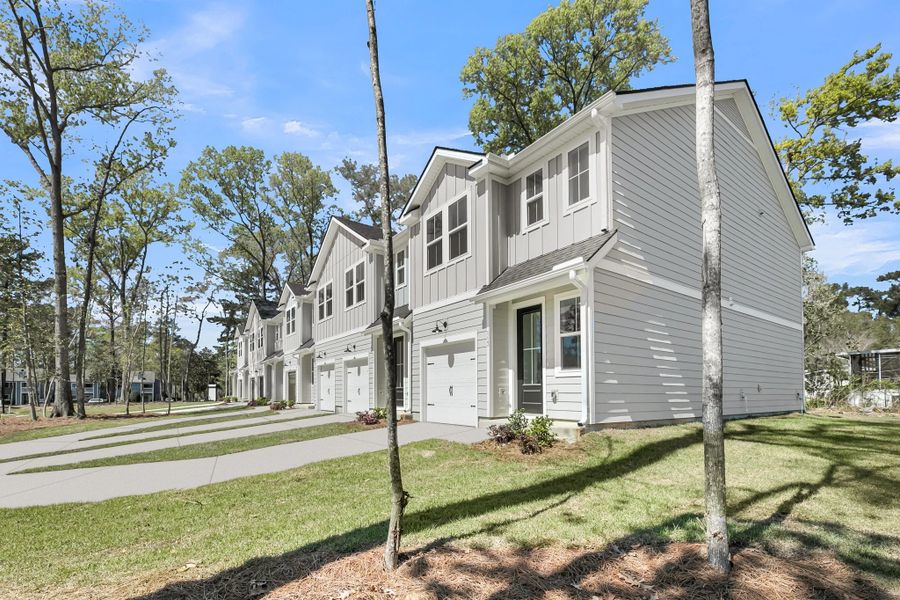 Front exterior of a new home in Windward Village, Summerville, SC, highlighting curb appeal (Image 1). Front exterior of a new home in Windward Village, Summerville, SC, highlighting curb appeal (Image 1).