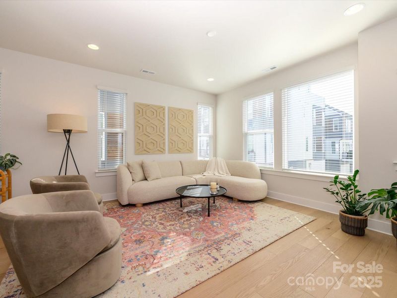 Recessed light and prewired for a ceiling fan in this great room.