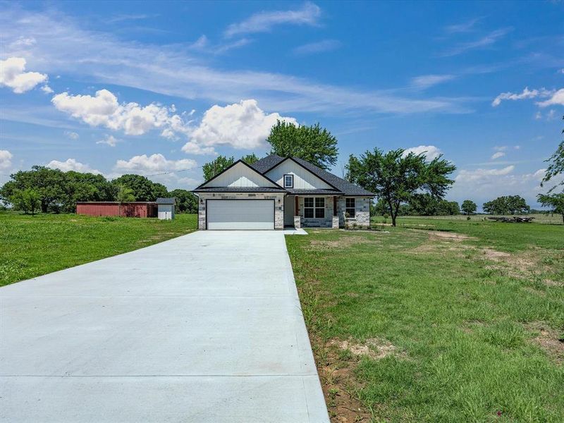 Front exterior of a new home in , Bowie, TX, highlighting curb appeal (Image 19).
