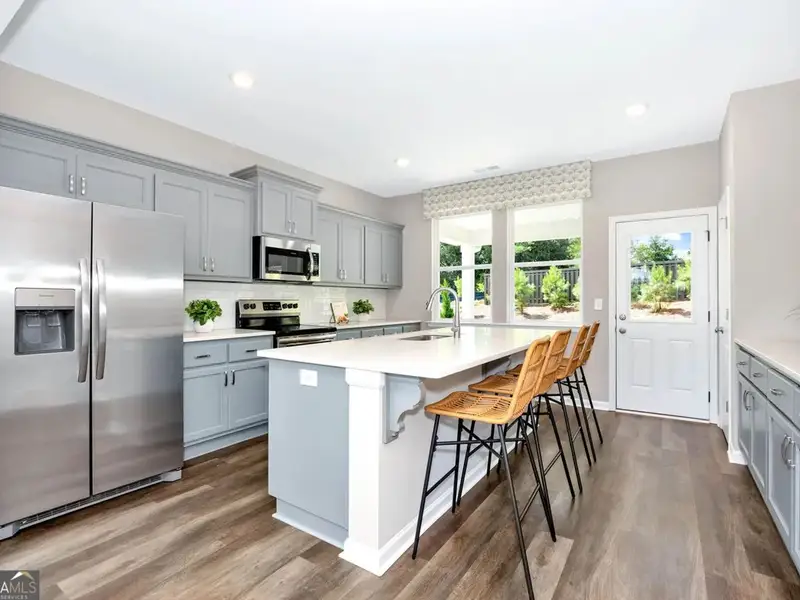 Furnished interior view inside a new home in Ivy Glen, Perry (Image 4).