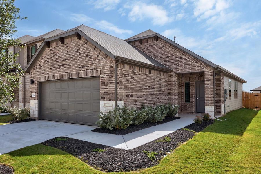 Front exterior of a new home in Trinity Ranch, Elgin, TX, highlighting curb appeal (Image 19). Front exterior of a new home in Trinity Ranch, Elgin, TX, highlighting curb appeal (Image 19).