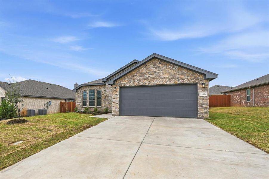 Front exterior of a new home in Trail Creek, Cleburne, TX, highlighting curb appeal (Image 22). Front exterior of a new home in Trail Creek, Cleburne, TX, highlighting curb appeal (Image 22).