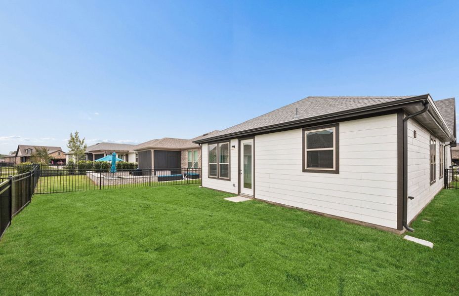 Exterior details and patio area of a home in Del Webb in Chambers Creek, Willis (Image 3).