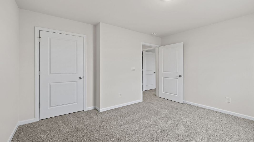 Spacious, unfurnished interior of a new home in Bentley Park, Greenwood (Image 21).