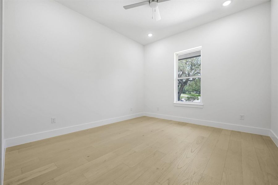 Unfurnished room featuring light wood-style floors, recessed lighting, and a ceiling fan