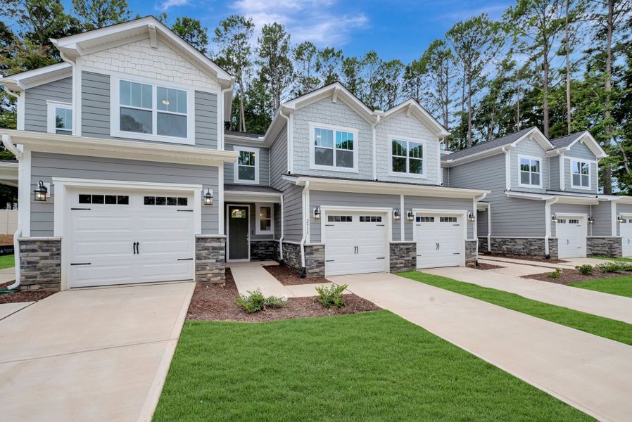 Front exterior of a new home in Ashmore Townes, Garner, NC, highlighting curb appeal (Image 16). Front exterior of a new home in Ashmore Townes, Garner, NC, highlighting curb appeal (Image 16).