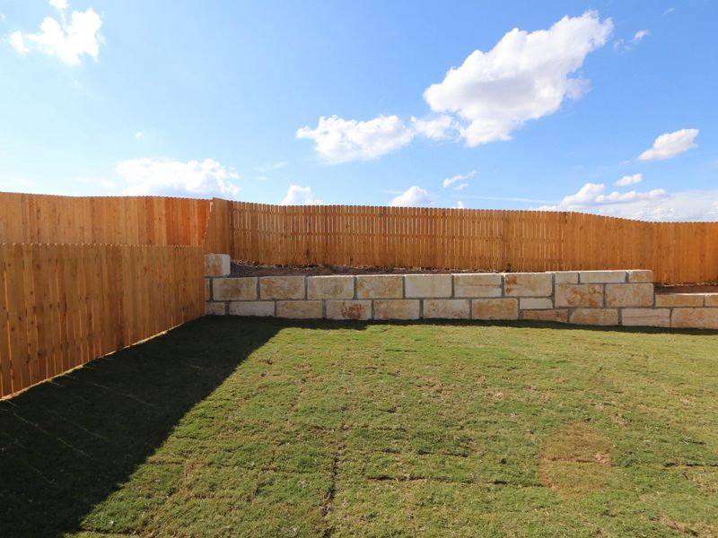Exterior details and patio area of a home in Cascades at Onion Creek, Austin (Image 3).