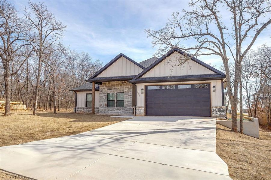 Front exterior of a new home in , Runaway Bay, TX, highlighting curb appeal (Image 29). Front exterior of a new home in , Runaway Bay, TX, highlighting curb appeal (Image 29).