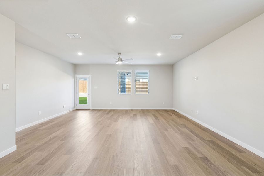 Living and Dining Room in the Haylee home plan by Trophy Signature Homes - REPRESENTATIVE PHOTO