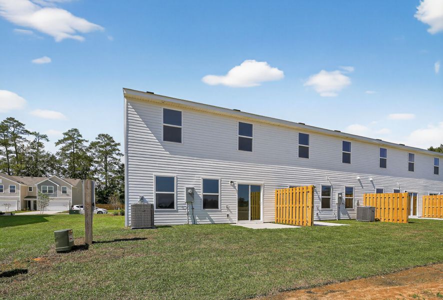 A house with a fence around it. A house with a fence around it.