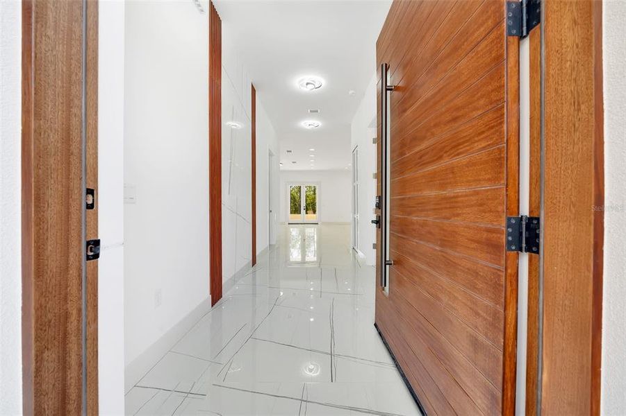 FRONT 4'X8' MAHONY DOOR ENTRANCE AND FOYER