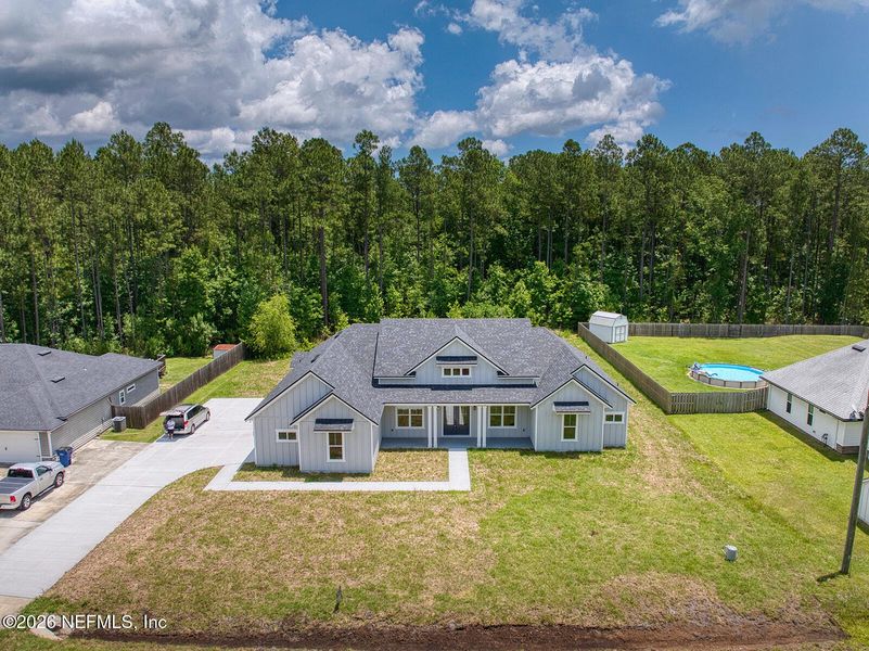 Front exterior of a new home in , Yulee, FL, highlighting curb appeal (Image 27).
