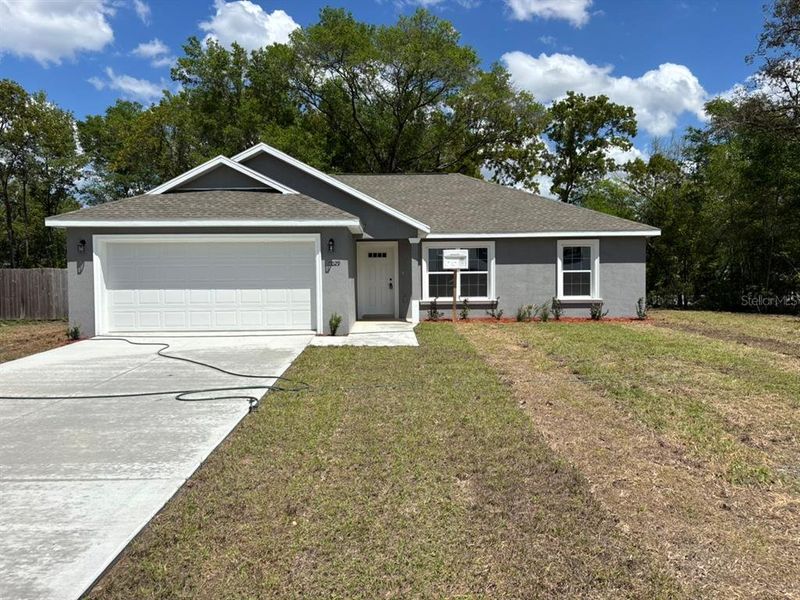 Front exterior of a new home in , Dunnellon, FL, highlighting curb appeal (Image 1). Front exterior of a new home in , Dunnellon, FL, highlighting curb appeal (Image 1).