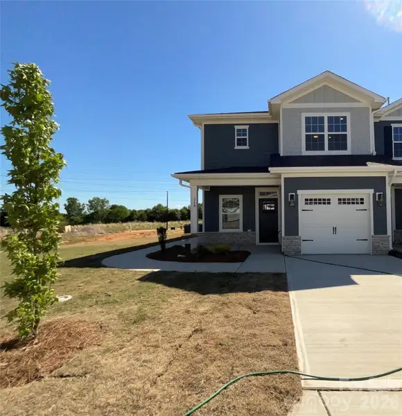Front exterior of a new home in Pine Trace, Gastonia, NC, highlighting curb appeal (Image 2). Front exterior of a new home in Pine Trace, Gastonia, NC, highlighting curb appeal (Image 2).