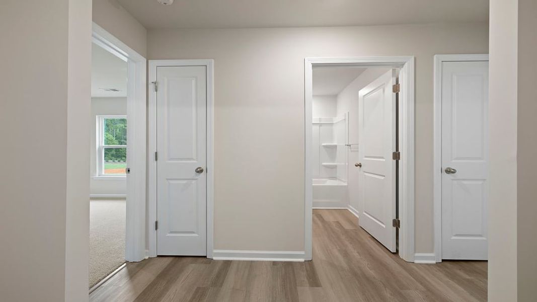 Spacious, unfurnished interior of a new home in Bentley Park, Greenwood (Image 15).