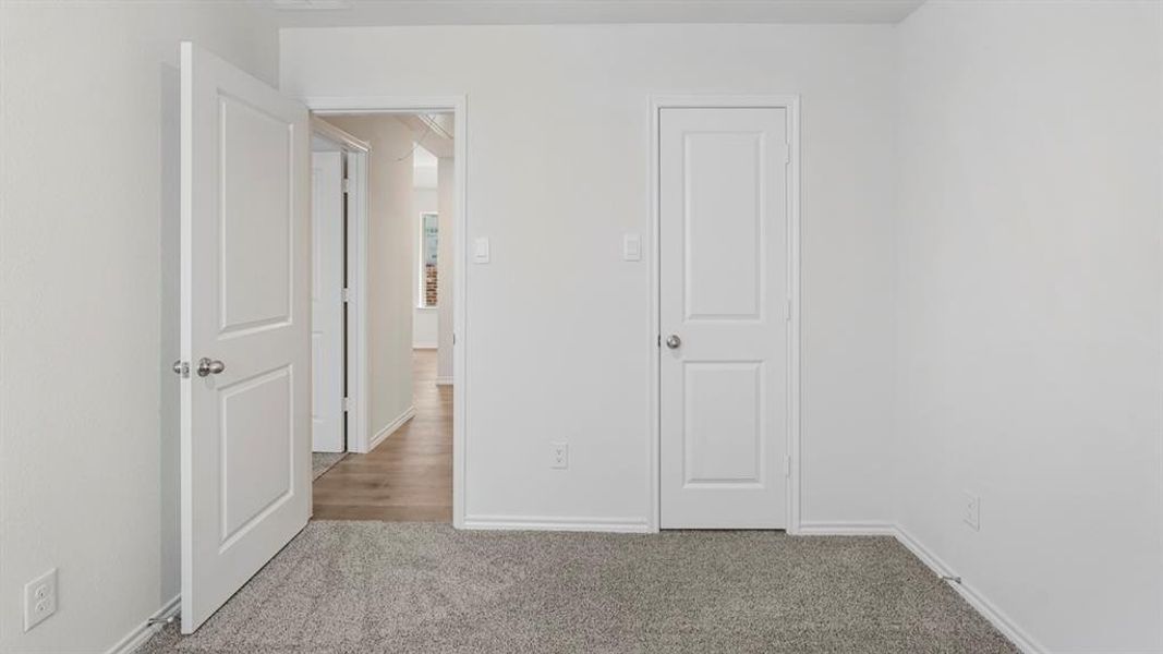Neutral gray carpeted flooring