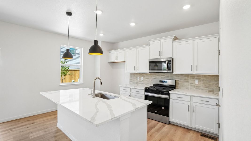 Furnished interior view inside a new home in Trails at Crowfoot, Parker (Image 6).