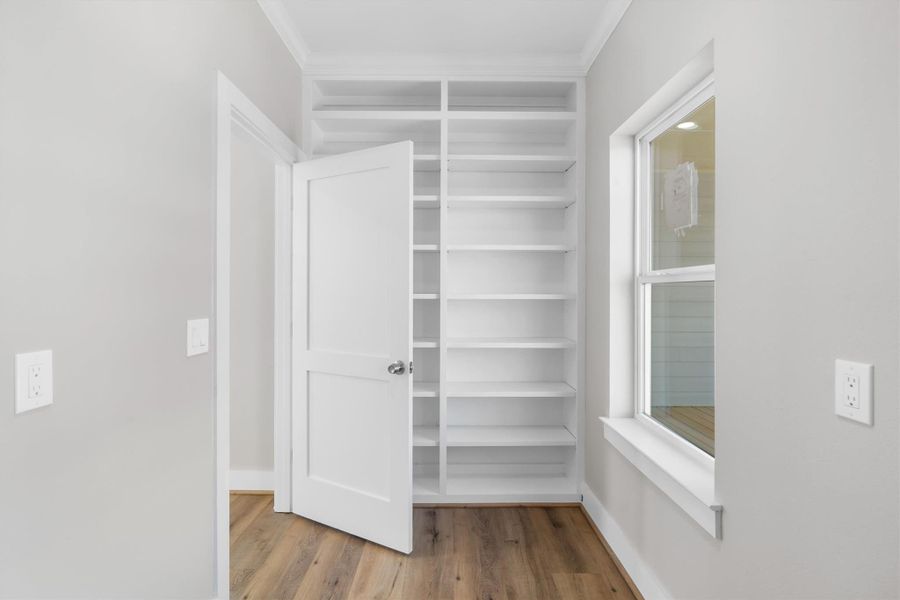 Large laundry room with built in storage shelves/pantry space Large laundry room with built in storage shelves/pantry space