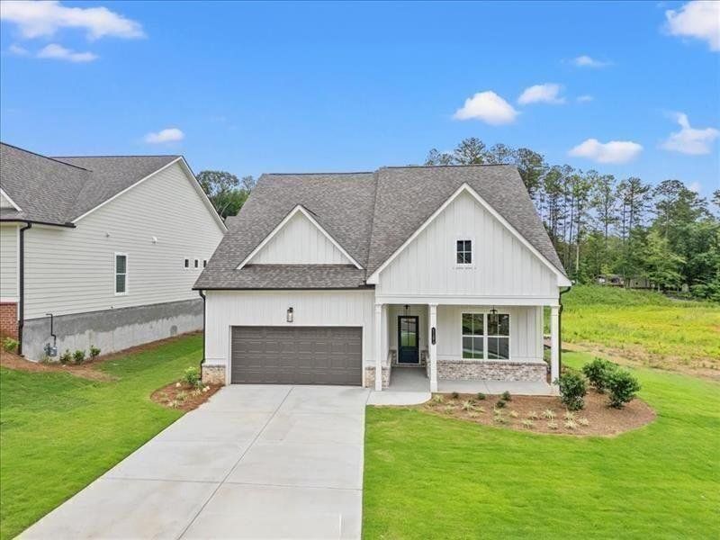 Front exterior of a new home in Cooks Farm, Woodstock, GA, highlighting curb appeal (Image 32).