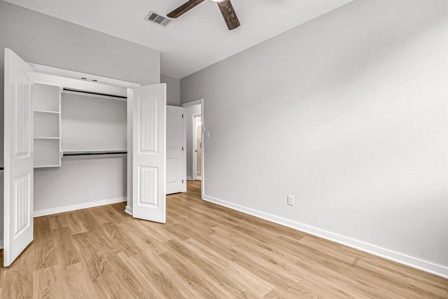 A second guest bedroom also has a closet with built ins.