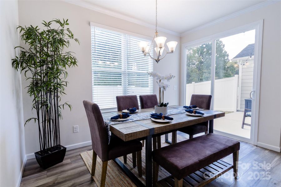 Bright Dining area with glass door to patio