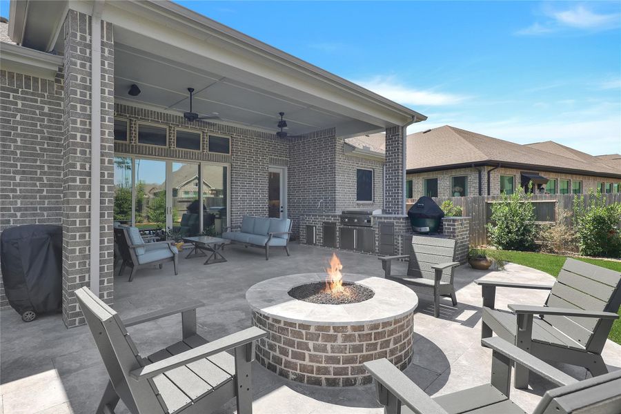 Upgraded patio with fireplace, pavers and artificial turf. OVER 60K in upgrades!