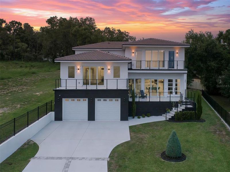 Front exterior of a new home in , Clermont, FL, highlighting curb appeal (Image 30). Front exterior of a new home in , Clermont, FL, highlighting curb appeal (Image 30).