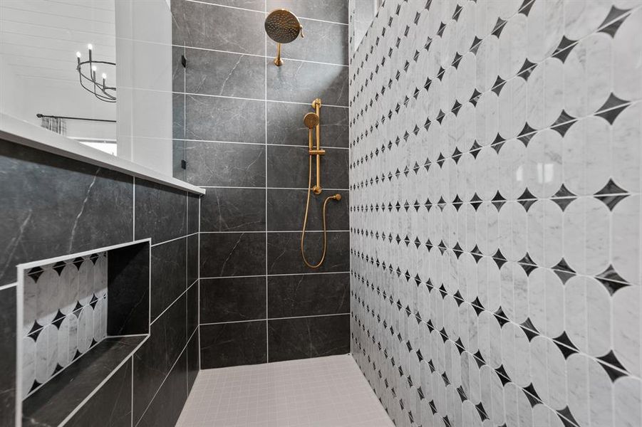 Full bathroom featuring tiled shower Full bathroom featuring tiled shower