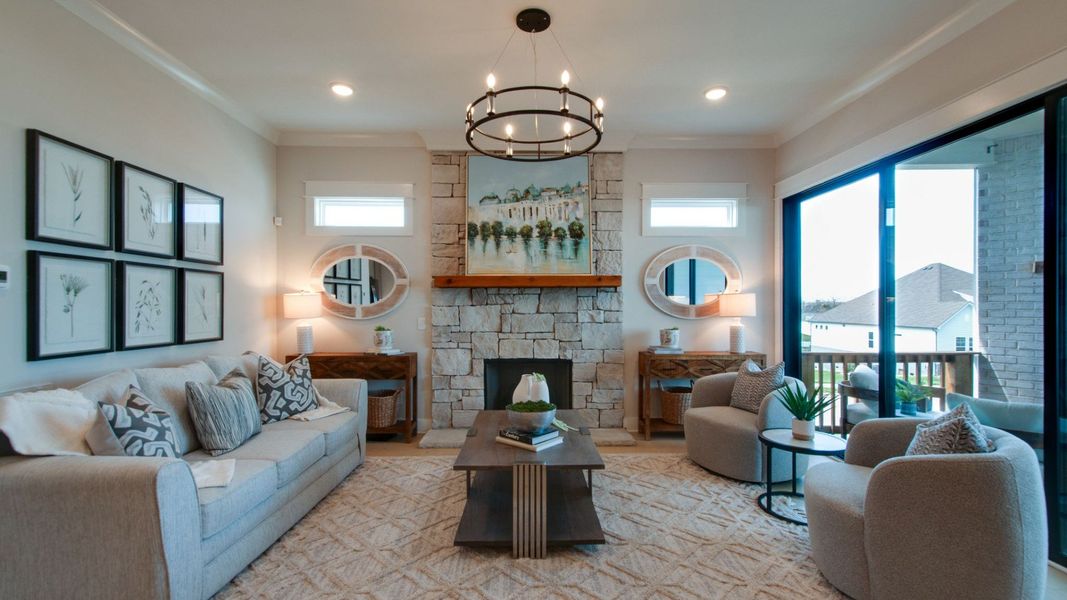 Gathering room with connecting dining area and large glass sliding doors out to the covered outdoor patio space Gathering room with connecting dining area and large glass sliding doors out to the covered outdoor patio space