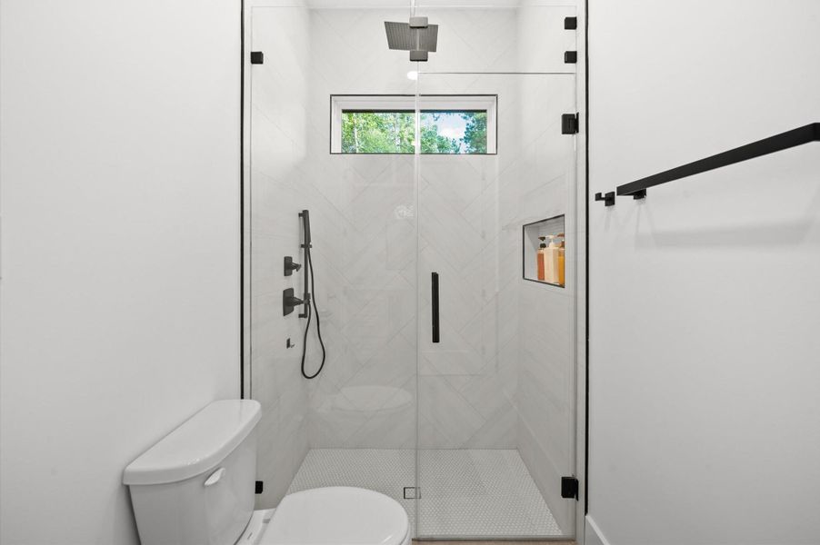 Secondary full bathroom offers modern finishes and designer-selected fixtures.