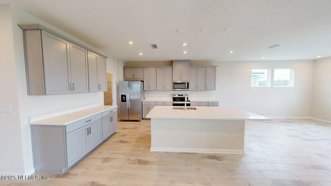 Furnished interior view inside a new home in Lakes at Bella Lago, Green Cove Springs (Image 2).