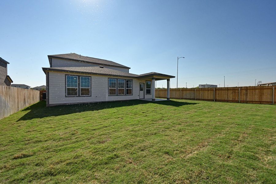 Exterior details and patio area of a home in Mustang Valley, Manor (Image 20). Exterior details and patio area of a home in Mustang Valley, Manor (Image 20).
