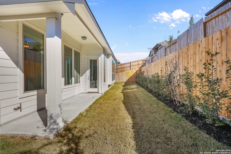 Exterior details and patio area of a home in Homestead 65', Schertz (Image 23).