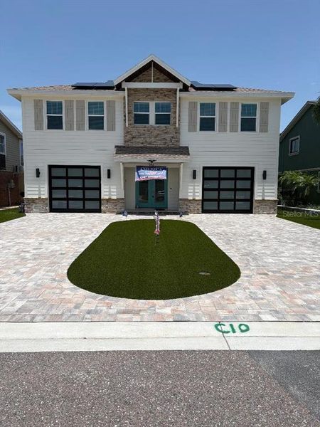 Front exterior of a new home in , Indian Rocks Beach, FL, highlighting curb appeal (Image 1). Front exterior of a new home in , Indian Rocks Beach, FL, highlighting curb appeal (Image 1).