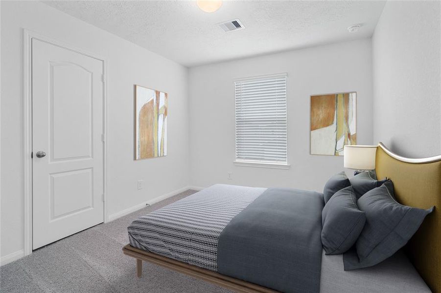 Secondary bedroom features plush carpet, neutral paint, lighting, large window with privacy blinds and ample sized closet space.