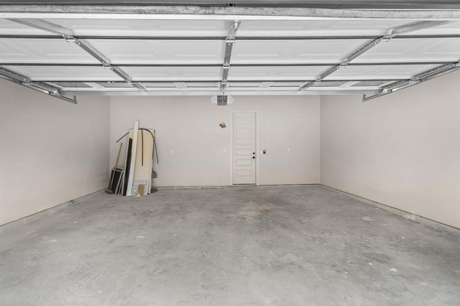 Garage featuring a garage door opener