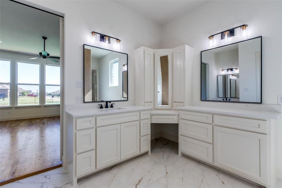 Bathroom with ceiling fan, vanity, and hardwood / wood-style flooring