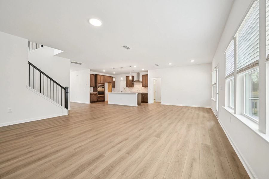 Family Room featuring the AW Collection® Roosevelt - Warm finishes make this room hosting-ready.