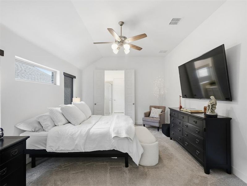 The spacious primary provides vaulted ceilings, beautiful sunlight and ample space to relax!