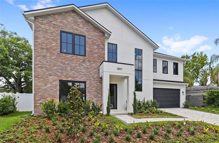 Front exterior of a new home in , Orlando, FL, highlighting curb appeal (Image 29).
