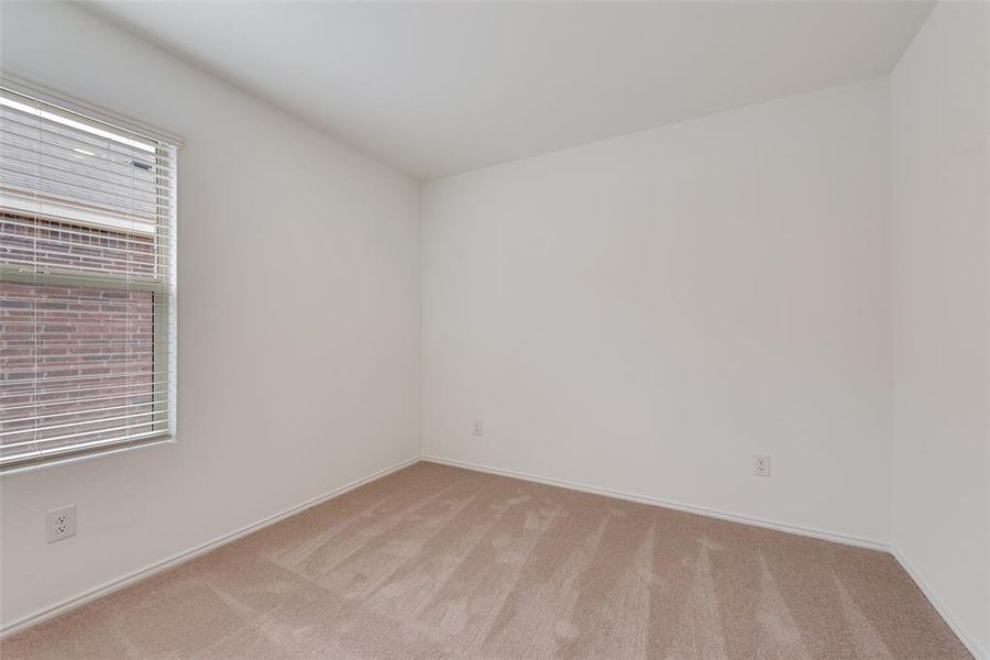 Carpeted spare room with plenty of natural light