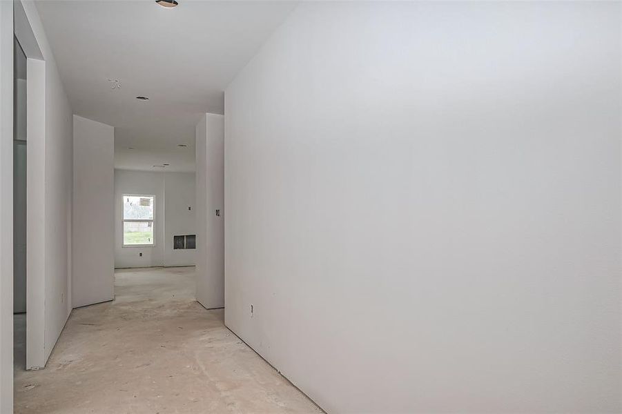 A preview of the home’s openness, this entryway offers a direct sightline into the living area, setting the stage for a flowing layout.