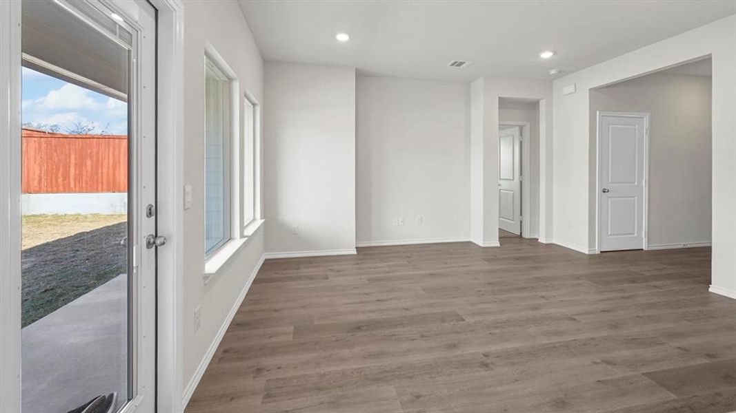 Empty room featuring wood finished floors and recessed lighting