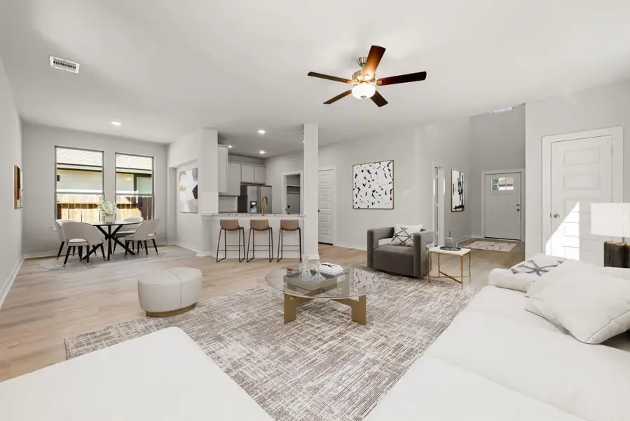 This bright and inviting open-concept living space features expansive windows that fill the room with natural light. The seamless flow between the living, dining, and kitchen areas creates an airy and functional layout. Modern finishes, recessed lighting, and warm wood-look flooring add to the home’s clean and contemporary appeal. This bright and inviting open-concept living space features expansive windows that fill the room with natural light. The seamless flow between the living, dining, and kitchen areas creates an airy and functional layout. Modern finishes, recessed lighting, and warm wood-look flooring add to the home’s clean and contemporary appeal.