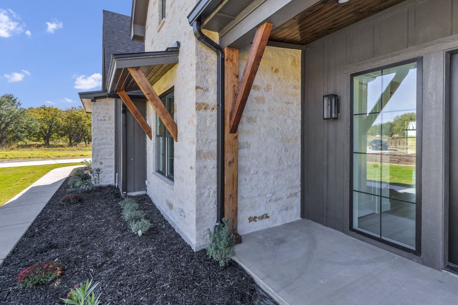 Front exterior of a new home in Oak Water Ranch, Granbury, TX, highlighting curb appeal (Image 31).
