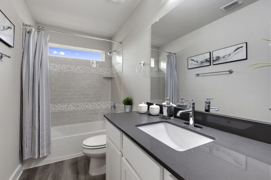 Representative furnished interior of a home built from the Houston by Pacesetter Homes in Village At Manor Commons, Manor (Image 17).