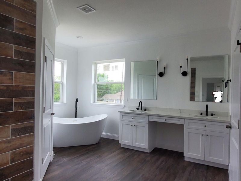 modern style designed the master bath with top grade material. Double walk in closets and freestanding bath!